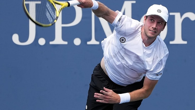 Aug 31, 2022; Flushing, NY, USA;  Botic van De Zandschulp of the Netherlands serves against Corentin Moutet of France on day three of the 2022 U.S. Open tennis tournament at USTA Billie Jean King Tennis Center. Mandatory Credit: Jerry Lai-USA TODAY Sports