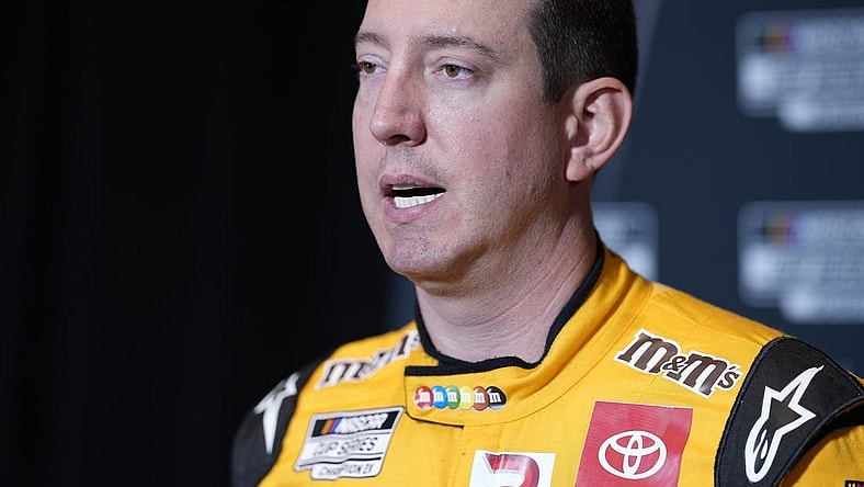 Sep 1, 2022; Charlotte, NC, USA; NASCAR Cup Series driver Kyle Busch (18) talks with the media during the NASCAR Cup Series Playoff Media Day at Charlotte Convention Center. Mandatory Credit: Jim Dedmon-USA TODAY Sports