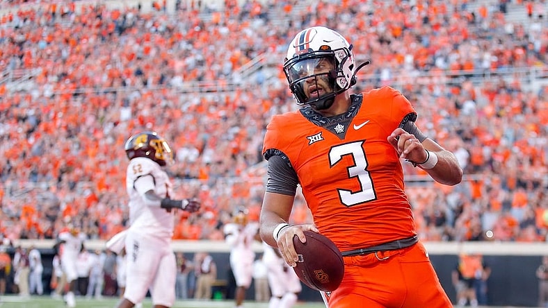 Oklahoma State's Spencer Sanders (3) scores a touchdown in the second quarter during the college football game between the Oklahoma State Cowboys and Central Michigan Chippewa at Boone Pickens Stadium in Stillwater, Oka., Thursday, Sept., 1, 2022. OSU won 58-44.

Osu Vs Central Michigan