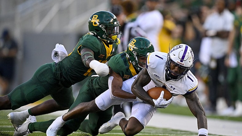 Sep 3, 2022; Waco, Texas, USA; Albany Great Danes wide receiver Julian Hicks (1) is tackled by Baylor Bears safety Al Walcott (13) during the second quarter at McLane Stadium. Mandatory Credit: Jerome Miron-USA TODAY Sports