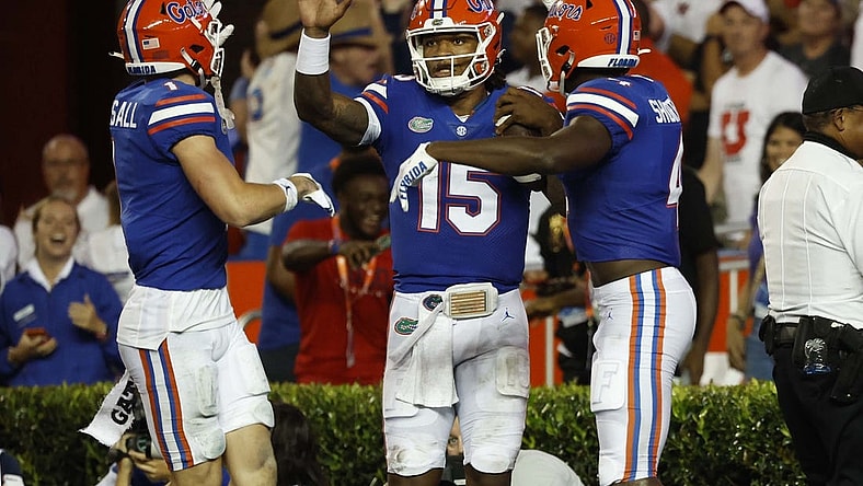 Sep 3, 2022; Gainesville, Florida, USA; Florida Gators quarterback Anthony Richardson (15) is congratulated  by wide receiver Justin Shorter (4) and wide receiver Ricky Pearsall (1) as he scored a touchdown during the second quarter at Steve Spurrier-Florida Field. Mandatory Credit: Kim Klement-USA TODAY Sports