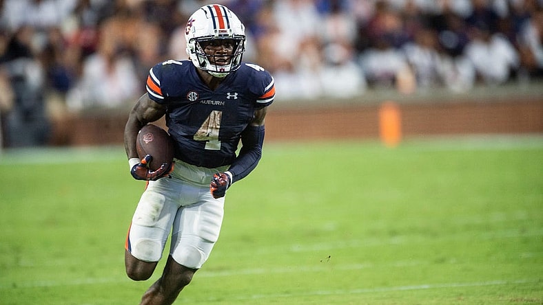 Auburn Tigers running back Tank Bigsby (4) runs the ball as Auburn Tigers take on Mercer Bears at Jordan-Hare Stadium in Auburn, Ala., on Saturday, Sept. 3, 2022. Auburn Tigers leads Mercer Bears 28-7 at halftime.