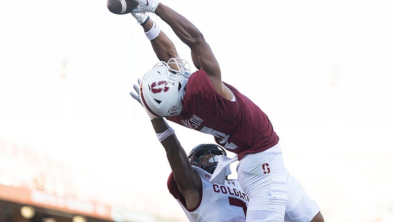Sep 3, 2022; Stanford, California, USA;  Stanford Cardinal wide receiver Michael Wilson (4) catches the ball for a touchdown over Colgate Raiders defensive back Asauni Allen (7) during the second quarter at Stanford Stadium. Mandatory Credit: Stan Szeto-USA TODAY Sports