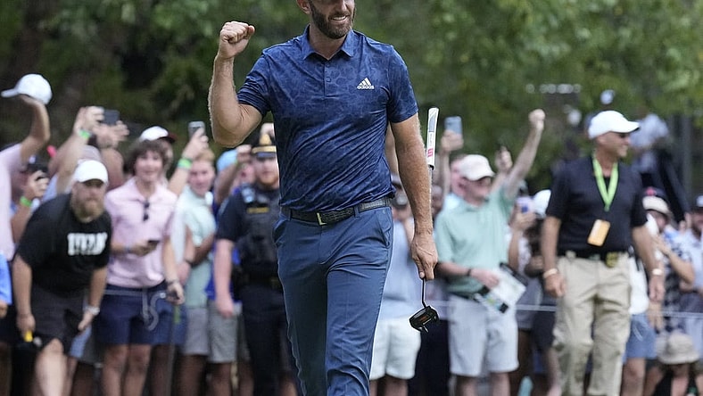 Sep 4, 2022; Boston, Massachusetts, USA; Dustin Johnson celebrates with a fist punch after putting to win the 2022 LIV Golf Invitational Boston after the final round playoff hole of the LIV Golf tournament at The International. Mandatory Credit: Richard Cashin-USA TODAY Sports
