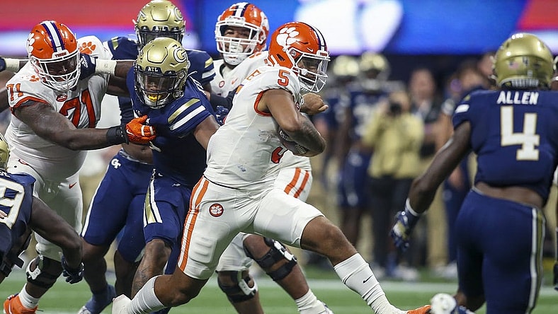 Sep 5, 2022; Atlanta, Georgia, USA; Clemson Tigers quarterback DJ Uiagalelei (5) runs the ball against the Georgia Tech Yellow Jackets in the second quarter at Mercedes-Benz Stadium. Mandatory Credit: Brett Davis-USA TODAY Sports