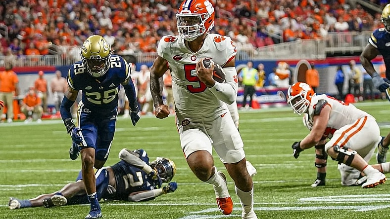 Sep 5, 2022; Atlanta, Georgia, USA; Clemson Tigers quarterback DJ Uiagalelei (5) runs for a touchdown against the Georgia Tech Yellow Jackets during the second half at Mercedes-Benz Stadium. Mandatory Credit: Dale Zanine-USA TODAY Sports