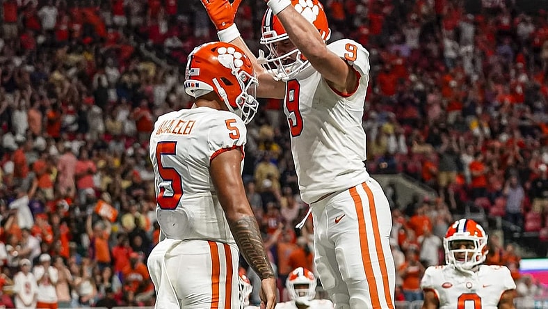 Sep 5, 2022; Atlanta, Georgia, USA; Clemson Tigers quarterback DJ Uiagalelei (5) reacts with tight end Jake Briningstool (9) after running for a touchdown against the Georgia Tech Yellow Jackets during the second half at Mercedes-Benz Stadium. Mandatory Credit: Dale Zanine-USA TODAY Sports