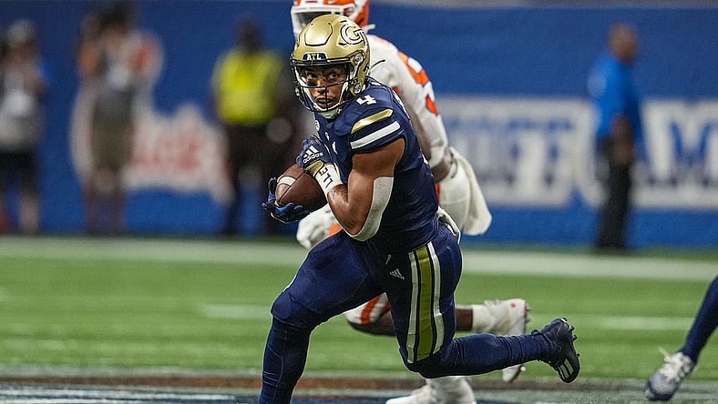Sep 5, 2022; Atlanta, Georgia, USA; Georgia Tech Yellow Jackets running back Dontae Smith (4) runs against the Clemson Tigers during the first half at Mercedes-Benz Stadium. Mandatory Credit: Dale Zanine-USA TODAY Sports