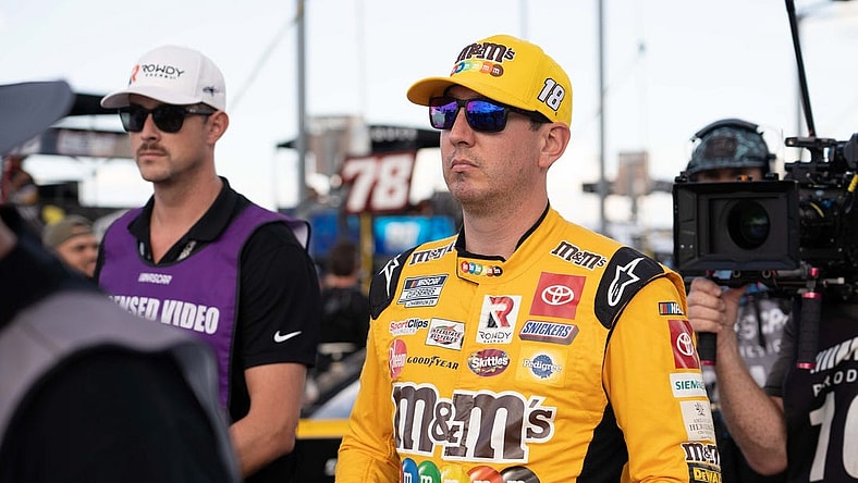 Sep 4, 2022; Darlington, South Carolina, USA; Kyle Busch, driver of the (18) M&M's Toyota, arrives for driver introductions prior to the COOK OUT Southern 500 at Darlington Raceway. Mandatory Credit: David Yeazell-USA TODAY Sports