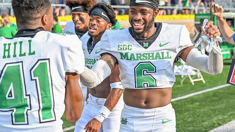 Sep 10, 2022; South Bend, Indiana, USA; Marshall Thundering Herd defensive back Micah Abraham (6) celebrates as he leaves the field after the Thundering Herd beat the Notre Dame Fighting Irish 26-21 at Notre Dame Stadium. Mandatory Credit: Matt Cashore-USA TODAY Sports