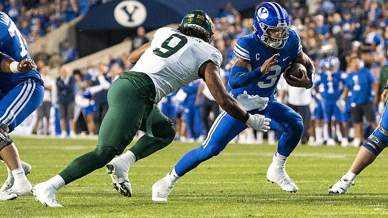 Sep 10, 2022; Provo, Utah, USA; Brigham Young Cougars quarterback Jaren Hall (3) runs the ball against Baylor Bears defensive lineman TJ Franklin (9) during the first half at LaVell Edwards Stadium. Mandatory Credit: Gabriel Mayberry-USA TODAY Sports