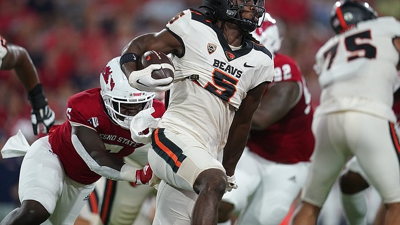 Sep 10, 2022; Fresno, California, USA; Oregon State Beavers running back Deshaun Fenwick (5) runs the ball against the Fresno State Bulldogs in the first quarter at Valley Children's Stadium. Mandatory Credit: Cary Edmondson-USA TODAY Sports