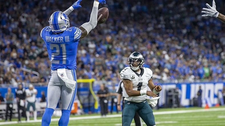 Sep 11, 2022; Detroit, Michigan, USA; Detroit Lions safety Tracy Walker III (21) blocks a pass attempt by Philadelphia Eagles quarterback Jalen Hurts (1) in the second quarter at Ford Field. Mandatory Credit: David Reginek-USA TODAY Sports