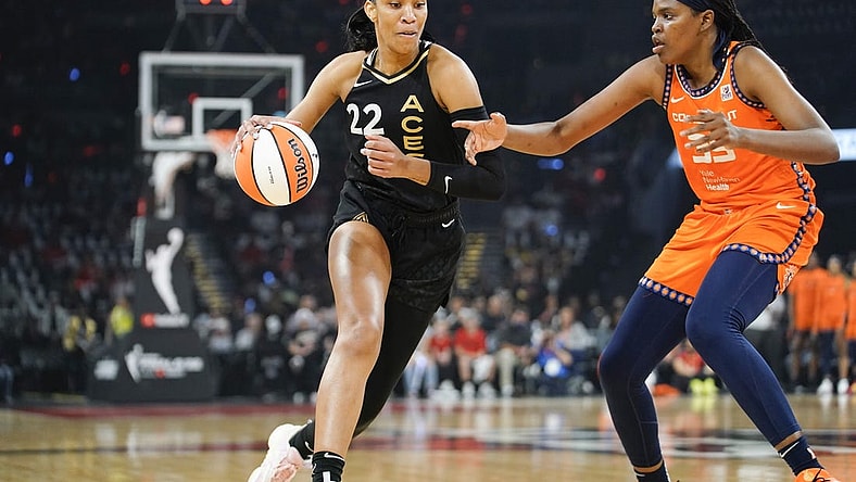 Sep 11, 2022; Las Vegas, Nevada, USA; Las Vegas Aces forward A'ja Wilson (22) drives the ball against Connecticut Sun forward Jonquel Jones (35) in the first quarter during game one of the 2022 WNBA Finals at Michelob Ultra Arena. Mandatory Credit: Lucas Peltier-USA TODAY Sports