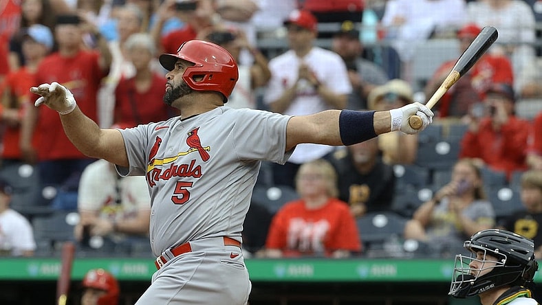 Sep 11, 2022; Pittsburgh, Pennsylvania, USA;  St. Louis Cardinals first baseman Albert Pujols (5) hits a two-run home run against the Pittsburgh Pirates during the ninth inning at PNC Park. The home run is the 697th home run of Pujols' career giving him sole possession of fourth place all time on the MLB career home run list. The Cardinals won 4-3. Mandatory Credit: Charles LeClaire-USA TODAY Sports