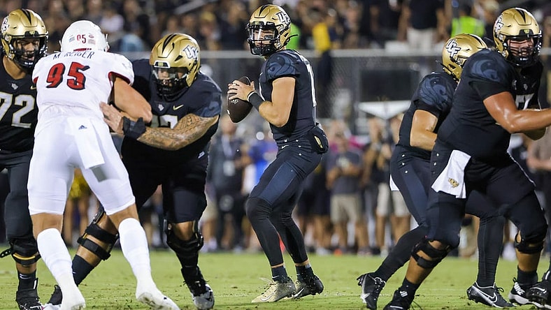 Sep 9, 2022; Orlando, Florida, USA; UCF Knights quarterback John Rhys Plumlee (10) drops back to pass during the first quarter against the Louisville Cardinals at FBC Mortgage Stadium. Mandatory Credit: Mike Watters-USA TODAY Sports
