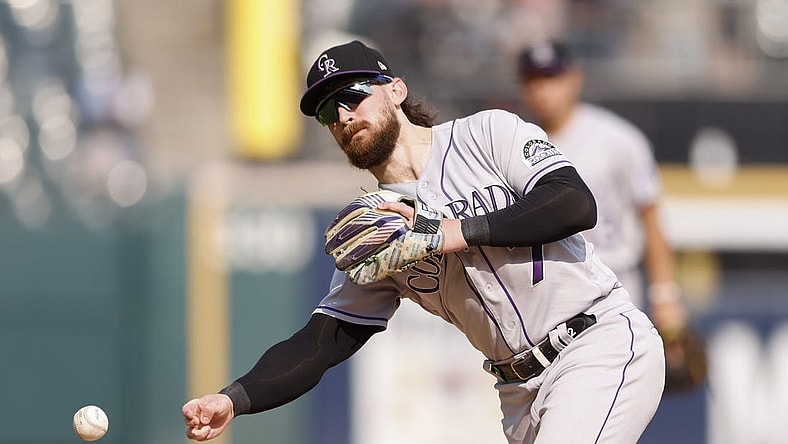 Sep 14, 2022; Chicago, Illinois, USA; Colorado Rockies second baseman Brendan Rodgers (7) throws to first base for an out against the Chicago White Sox during the sixth inning at Guaranteed Rate Field. Mandatory Credit: Kamil Krzaczynski-USA TODAY Sports