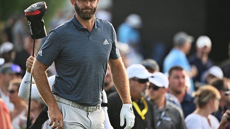 Sep 16, 2022; Chicago, Illinois, USA; Dustin Johnson walks up the 18th fairway during the first round of a LIV Golf tournament at Rich Harvest Farms. Mandatory Credit: Jamie Sabau-USA TODAY Sports