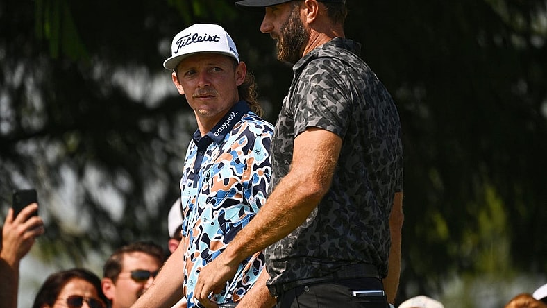 Sep 17, 2022; Chicago, Illinois, USA; Cameron Smith, left, and Dustin Johnson arrive on the the third tee during the second round of the Invitational Chicago LIV Golf tournament at Rich Harvest Farms. Mandatory Credit: Jamie Sabau-USA TODAY Sports