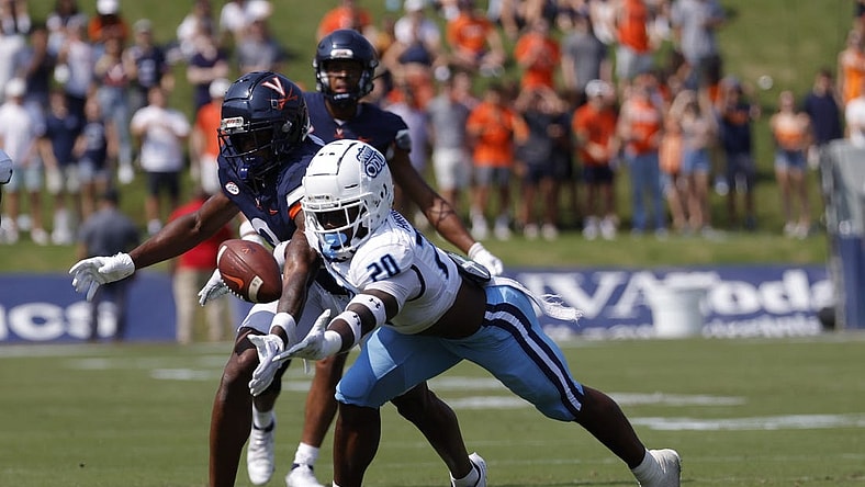 Sep 17, 2022; Charlottesville, Virginia, USA; Virginia Cavaliers wide receiver Dontayvion Wicks (3) attempts to make a catch as Old Dominion Monarchs cornerback Tobias Harris (20) defends during the first quarter at Scott Stadium. Mandatory Credit: Geoff Burke-USA TODAY Sports