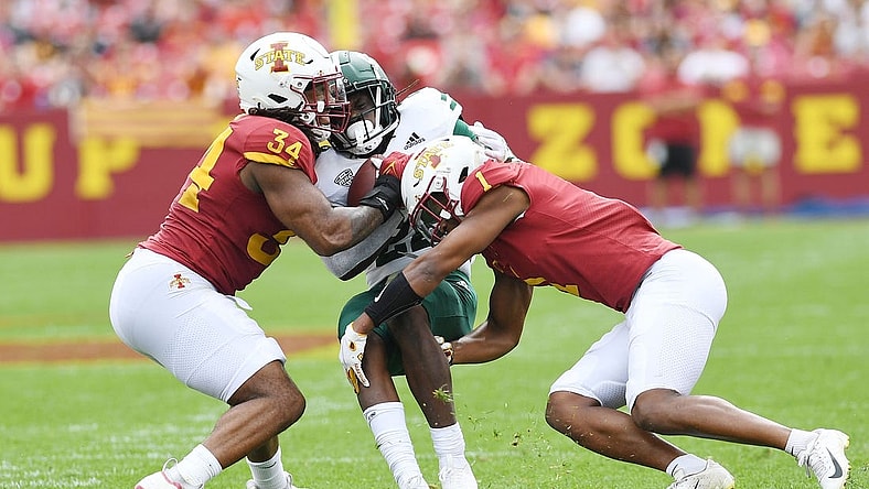 Iowa State Cyclones linebacker O'Rien Vance (34) and  defensive back Anthony Johnson Jr. (1) takes down Ohio Bobcats running back Sieh Bangura (22) during the first quarter at Jack Trice Stadium Saturday, Sept. 17, 2022, in Ames, Iowa.