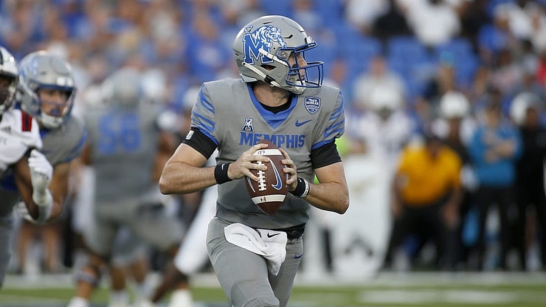 Sep 17, 2022; Memphis, Tennessee, USA; Memphis Tigers quarterback Seth Henigan (5) scrambles during the first half against the Arkansas State Red Wolves at Liberty Bowl Memorial Stadium. Mandatory Credit: Petre Thomas-USA TODAY Sports