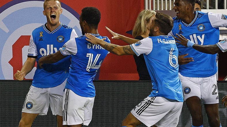Sep 17, 2022; Chicago, Illinois, USA; Charlotte FC forward Karol Swiderski (11) reacts after scoring the winning goal against the Chicago Fire during the second half at Soldier Field. Mandatory Credit: Mike Dinovo-USA TODAY Sports