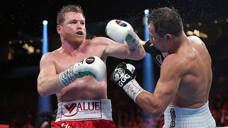 Sep 17, 2022; Las Vegas, Nevada, USA; Canelo Alvarez (red trunks) and Gennadiy Golovkin (white trunks) box during their super middleweight championship boxing bout at T-Mobile Arena. Mandatory Credit: Joe Camporeale-USA TODAY Sports