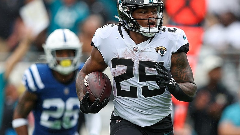 Sep 18, 2022; Jacksonville, Florida, USA;  Jacksonville Jaguars running back James Robinson (25) runs for a touchdown against the Indianapolis Colts in the second quarter at TIAA Bank Field. Mandatory Credit: Nathan Ray Seebeck-USA TODAY Sports