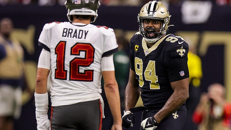 Sep 18, 2022; New Orleans, Louisiana, USA;  New Orleans Saints defensive end Cameron Jordan (94) stares at Tampa Bay Buccaneers quarterback Tom Brady (12) and reacts to a play during the second half at Caesars Superdome. Mandatory Credit: Stephen Lew-USA TODAY Sports