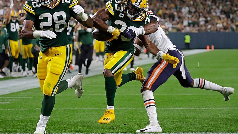 Green Bay Packers running back AJ Dillon (28) blocks for running back Aaron Jones (33) as he scores a touchdown against Chicago Bears safety Jaquan Brisker (9) in the second quarter during their football game Sunday, September 18, 2022, at Lambeau Field in Green Bay, Wis.

Mjs Apc Packvsbears 0918221070djp