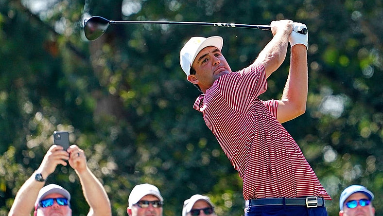 Sep 20, 2022; Charlotte, North Carolina, USA; Team USA golfer Scottie Scheffler plays his shot from the 15th tee during a practice day for the Presidents Cup golf tournament at Quail Hollow Club. Mandatory Credit: Peter Casey-USA TODAY Sports