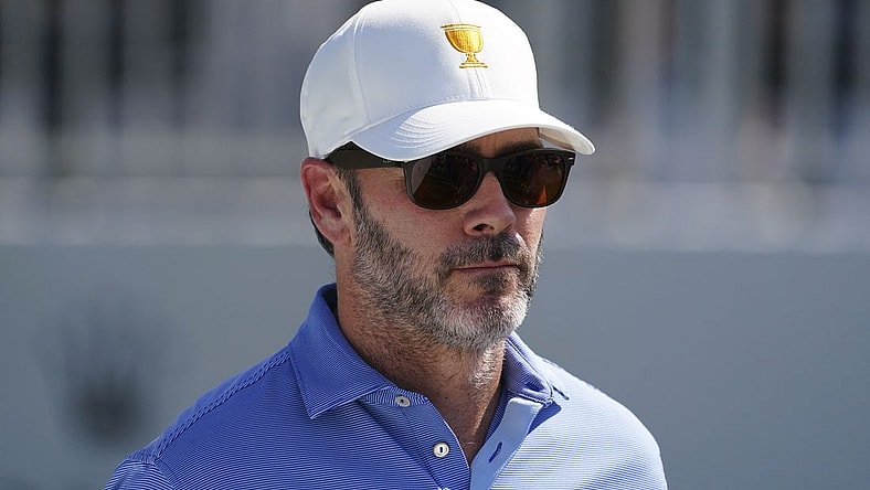 Sep 22, 2022; Charlotte, North Carolina, USA; Race car driver Jimmie Johnson stands on the eighth tee during the foursomes match play of the Presidents Cup golf tournament at Quail Hollow Club. Mandatory Credit: Peter Casey-USA TODAY Sports