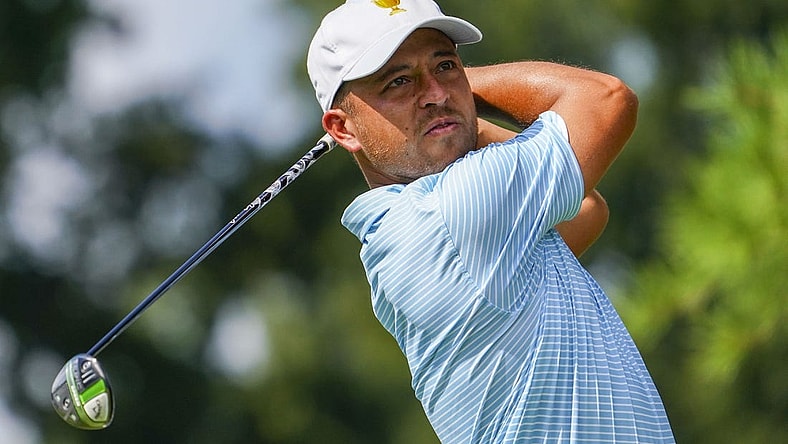 Sep 22, 2022; Charlotte, North Carolina, USA; Team USA golfer Xander Schauffele hits his tee shot on the eighth tee during the foursomes match play of the Presidents Cup golf tournament at Quail Hollow Club. Mandatory Credit: Peter Casey-USA TODAY Sports