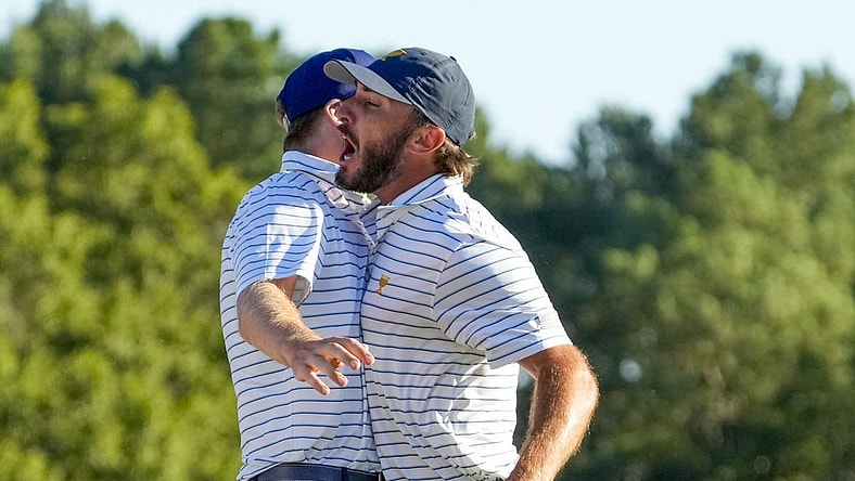 Sep 23, 2022; Charlotte, North Carolina, USA; Team USA golfer Max Homa celebrates on the 18th green during the four-ball match play of the Presidents Cup golf tournament at Quail Hollow Club. Mandatory Credit: Jim Dedmon-USA TODAY Sports