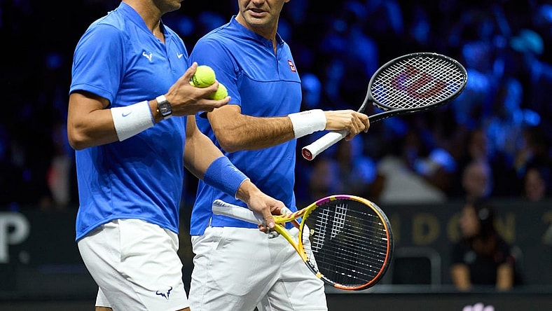 Sep 23, 2022; London, United Kingdom;  Roger Federer (SUI) and doubles partner Rafael Nadal (ESP) react while playing against Jack Sock (USA) and Frances Tiafoe in a Laver Cup tennis match.  Mandatory Credit: Peter van den Berg-USA TODAY Sports