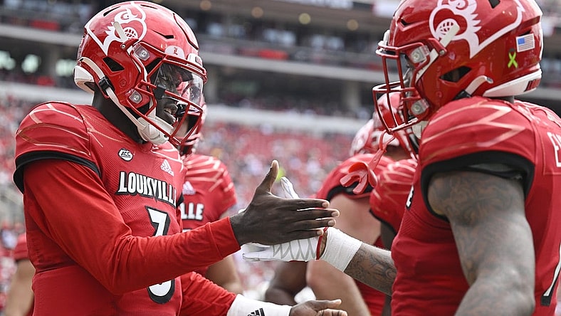 Sep 24, 2022; Louisville, Kentucky, USA; Louisville Cardinals quarterback Malik Cunningham (3) celebrates a touchdown with teammates during the second quarter against the South Florida Bulls at Cardinal Stadium. Mandatory Credit: Jamie Rhodes-USA TODAY Sports