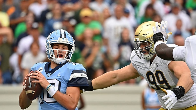 Sep 24, 2022; Chapel Hill, North Carolina, USA; North Carolina Tar Heels quarterback Drake Maye (10) is sacked by Notre Dame Fighting Irish defensive lineman Rylie Mills (99) in the first quarter at Kenan Memorial Stadium. Mandatory Credit: Bob Donnan-USA TODAY Sports