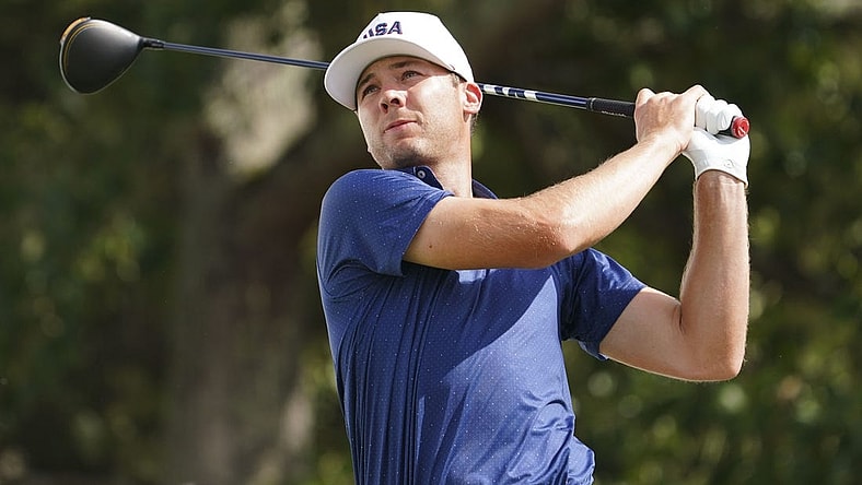 Sep 24, 2022; Charlotte, North Carolina, USA; Team USA golfer Sam Burns hits his tee shot on the 12th hole during the four-ball match play of the Presidents Cup golf tournament at Quail Hollow Club. Mandatory Credit: Peter Casey-USA TODAY Sports