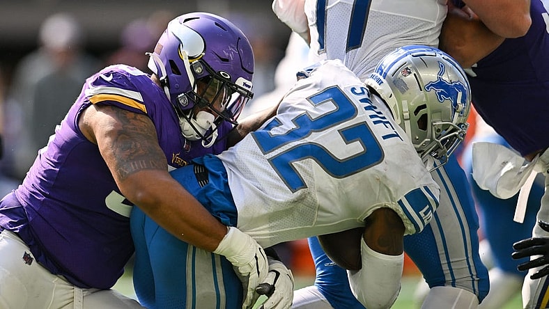 Sep 25, 2022; Minneapolis, Minnesota, USA; Detroit Lions running back D'Andre Swift (32) is tackled by Minnesota Vikings defensive end Jonathan Bullard (93) during the fourth quarter at U.S. Bank Stadium. Mandatory Credit: Jeffrey Becker-USA TODAY Sports