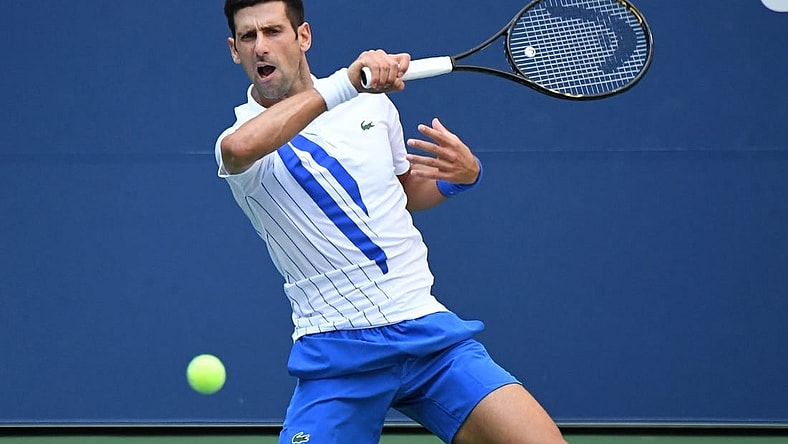 Sep 6, 2020; Flushing Meadows, New York, USA; Novak Djokovic of Serbia hits a forehand against Pablo Carreno Busta of Spain (not pictured) on day seven of the 2020 U.S. Open tennis tournament at USTA Billie Jean King National Tennis Center. Mandatory Credit: Danielle Parhizkaran-USA TODAY Sports