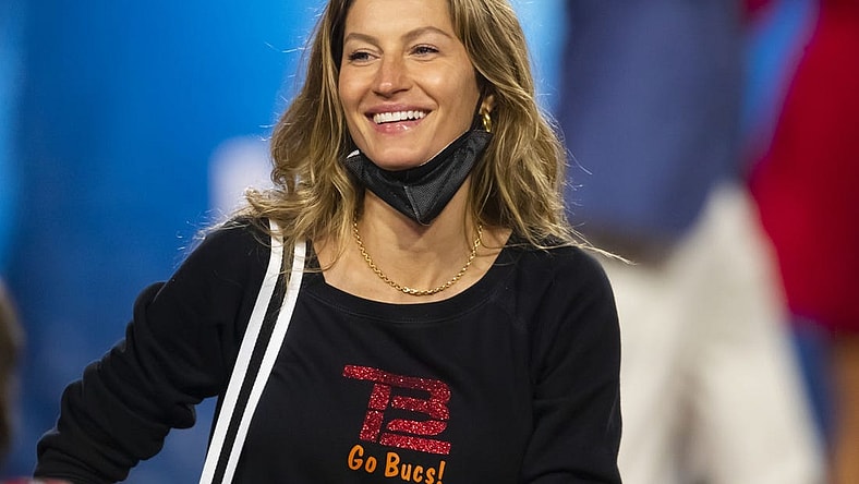 Feb 7, 2021; Tampa, FL, USA;  Gisele Bundchen, wife of Tampa Bay Buccaneers quarterback Tom Brady (not pictured) celebrates after defeating the Kansas City Chiefs in Super Bowl LV at Raymond James Stadium.  Mandatory Credit: Mark J. Rebilas-USA TODAY Sports