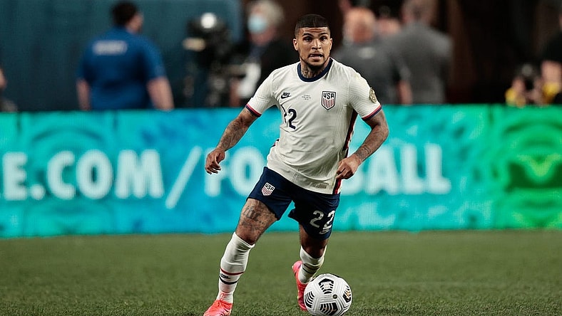 Jun 6, 2021; Denver, Colorado, USA; United States defender Deandre Yedlin (22) controls the ball in the second half against Mexico during the 2021 CONCACAF Nations League Finals soccer series final match at Empower Field at Mile High. Mandatory Credit: Isaiah J. Downing-USA TODAY Sports