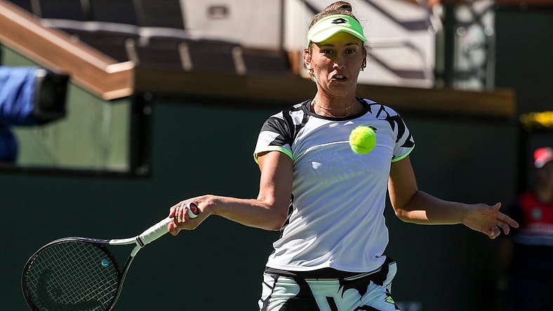 Elise Mertens of Belgium keeps her eyes on the ball to return while playing with doubles partner Su-Wei Hsieh of Taiwan against Veronika Kudermetova of Russia and Elena Rybakina of Kazakhstan during the women's doubles final of the BNP Paribas Open at the Indian Wells Tennis Garden, Saturday, Oct. 16, 2021, in Indian Wells, Calif.