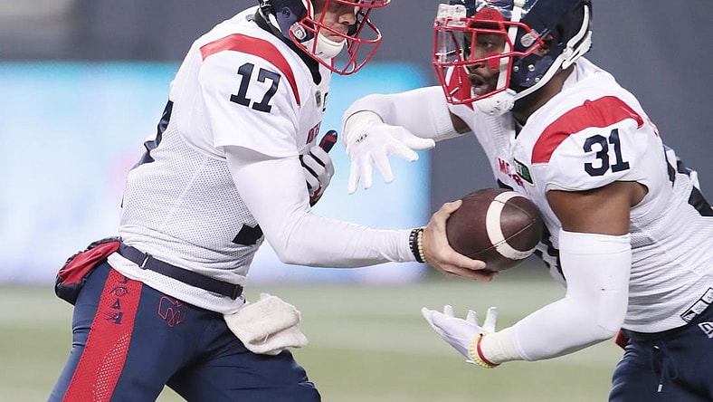 Nov 6, 2021; Winnipeg, Manitoba, CAN; Montreal Alouettes quarterback Trevor Harris (17) hands the ball off to Montreal Alouettes running back William Stanback (31) during the 2nd quarter against the Winnipeg Blue Bombers during a Canadian football League game at IG Field. Mandatory Credit: Bruce Fedyck-USA TODAY Sport
