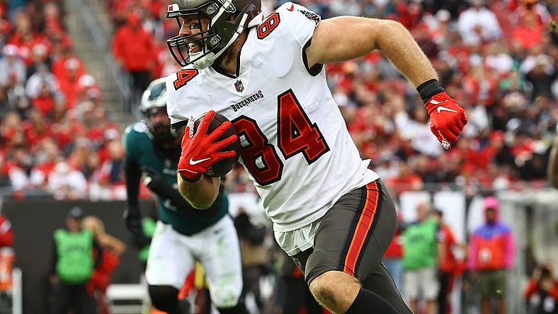 Jan 16, 2022; Tampa, Florida, USA; Tampa Bay Buccaneers tight end Cameron Brate (84) runs with the ball against the Philadelphia Eagles during the second half in a NFC Wild Card playoff football game at Raymond James Stadium. Mandatory Credit: Kim Klement-USA TODAY Sports