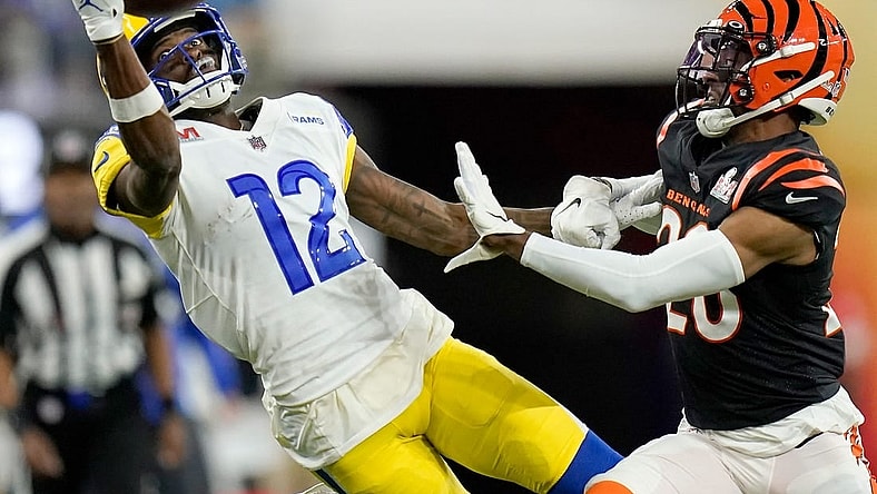 Los Angeles Rams wide receiver Van Jefferson (12) stretches for a pass before it lands incomplete under pressure from Cincinnati Bengals cornerback Eli Apple (20) in the fourth quarter of Super Bowl 56 between the Cincinnati Bengals and the Los Angeles Rams at SoFi Stadium in Inglewood, Calif., on Sunday, Feb. 13, 2022. The Rams came back in the final minutes of the game to win 23-20 on their home field.

Super Bowl 56 Cincinnati Bengals Vs La Rams