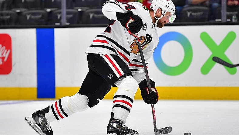 Mar 23, 2022; Anaheim, California, USA; Chicago Blackhawks defenseman Calvin de Haan (44) shoots on goal against the Anaheim Ducks during the first period at Honda Center. Mandatory Credit: Gary A. Vasquez-USA TODAY Sports