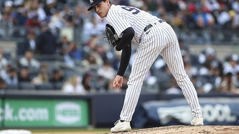 Apr 9, 2022; Bronx, New York, USA;  New York Yankees relief pitcher Ron Marinaccio (97) looks a runner back in the fourth inning against the Boston Red Sox at Yankee Stadium. Mandatory Credit: Wendell Cruz-USA TODAY Sports