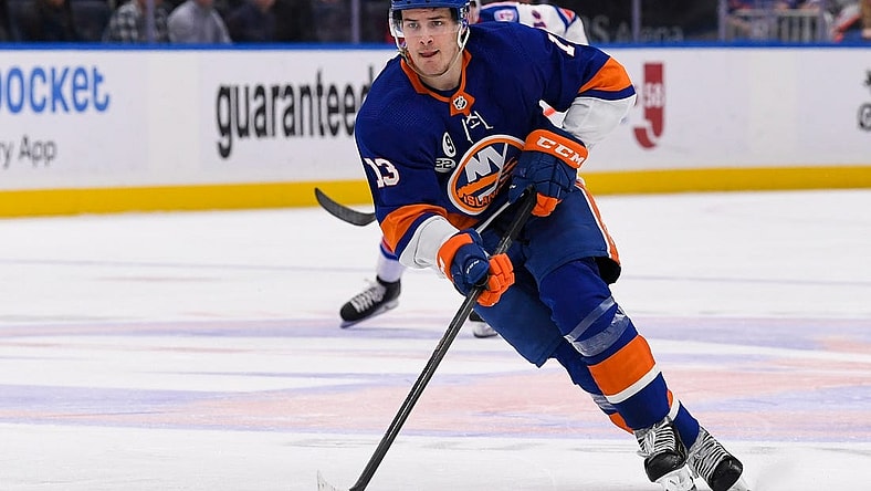 Apr 21, 2022; Elmont, New York, USA; New York Islanders center Mathew Barzal (13) skates across the blue line against the New York Rangers during the second period at UBS Arena. Mandatory Credit: Dennis Schneidler-USA TODAY Sports